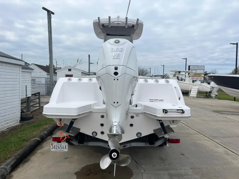 Slide: The Image of 2022 Everglades 235 Center Console boat with powerful outboard motor, docked on trailer. - 5