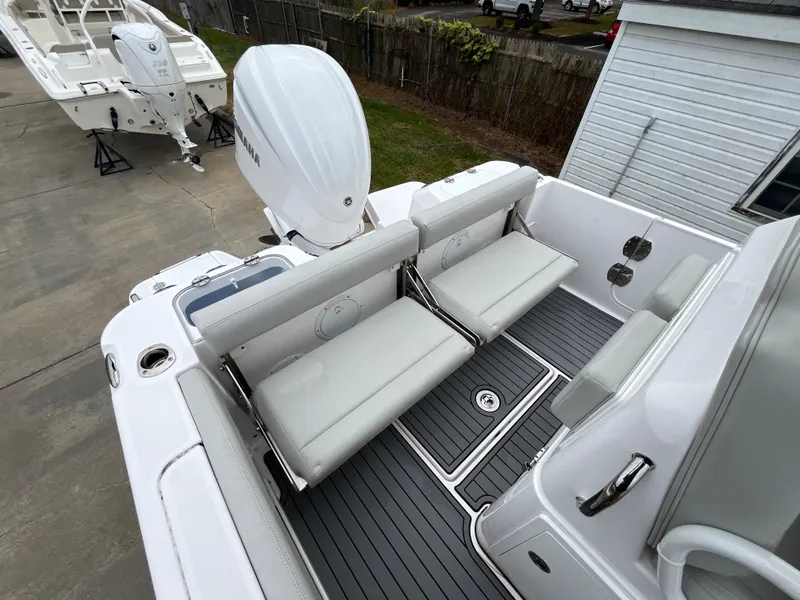 Slide: The Image of 2022 Everglades 235 Center Console boat with dual seating and outboard motor. - 9