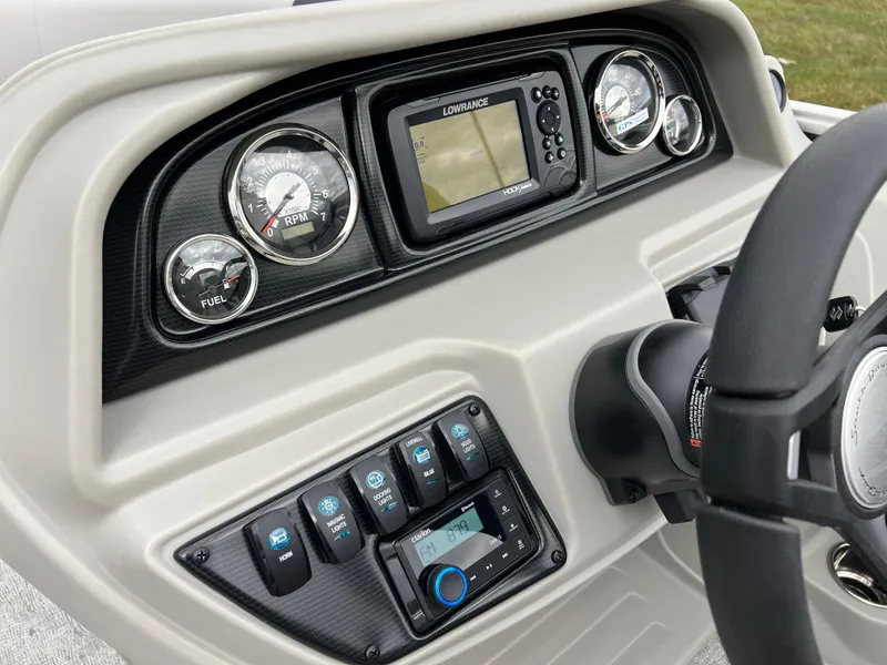 Slide: The Image of 2025 South Bay 222 RS LE boat dashboard with gauges and controls. - 19