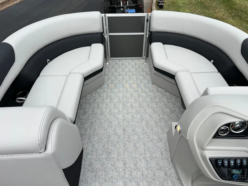 Slide: The Image of 2025 South Bay 222 RS LE pontoon boat interior with plush seating and modern design. - 23
