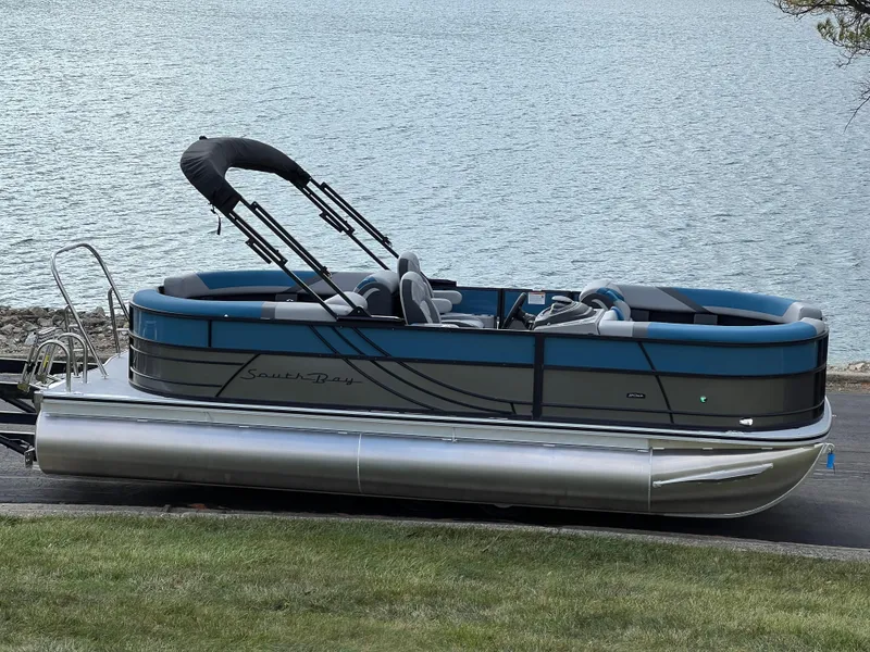 The Image of 2025 South Bay SS222 RS pontoon boat by the water. - 1