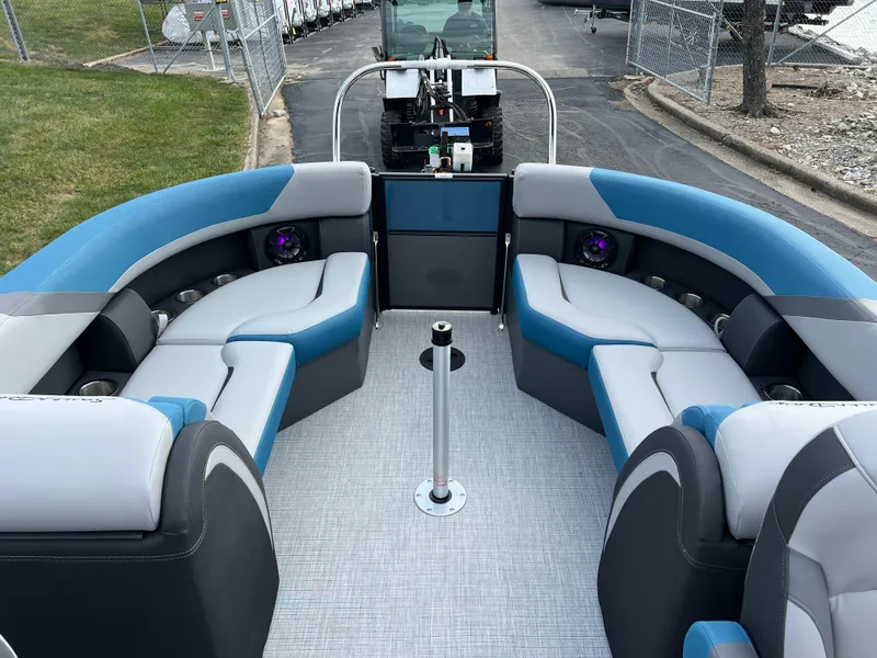 Slide: The Image of 2025 South Bay SS222 RS pontoon boat interior with blue and gray seating. - 15