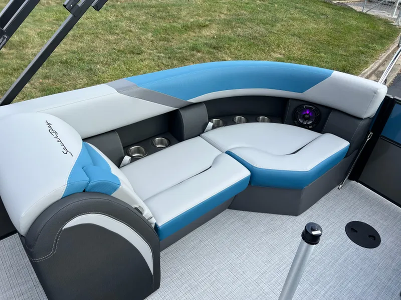 Slide: The Image of 2025 South Bay SS222 RS boat interior with blue and gray seating. - 16