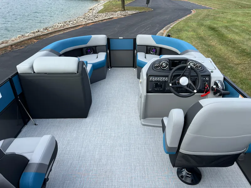 Slide: The Image of 2025 South Bay SS222 RS pontoon boat interior with modern seating and steering console. - 20