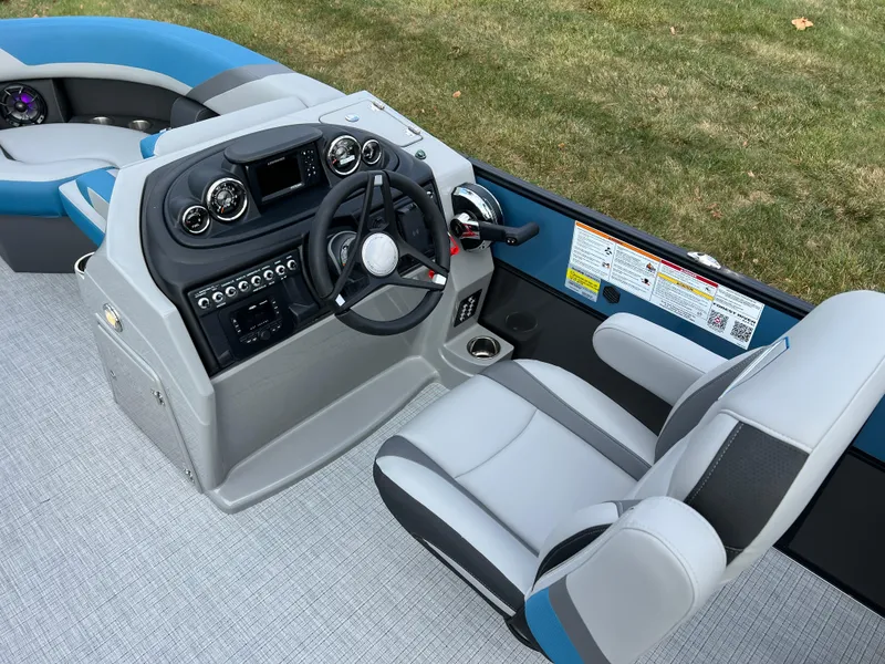 Slide: The Image of 2025 South Bay SS222 RS boat cockpit with modern steering and controls. - 21