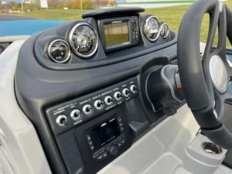Slide: The Image of 2025 South Bay SS222 RS boat dashboard with gauges and controls. - 22