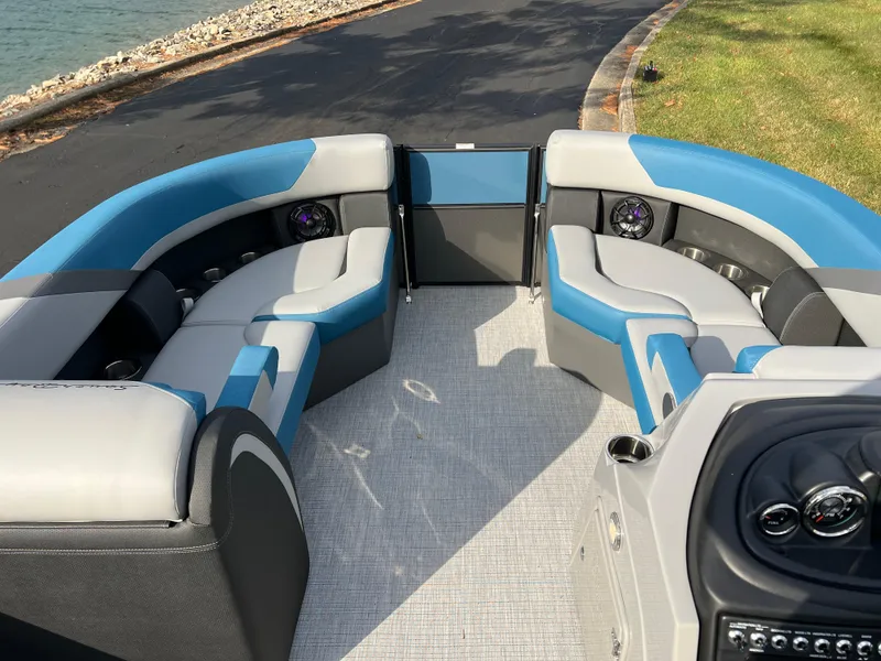 Slide: The Image of 2025 South Bay SS222 RS pontoon boat interior with blue and gray seating. - 26