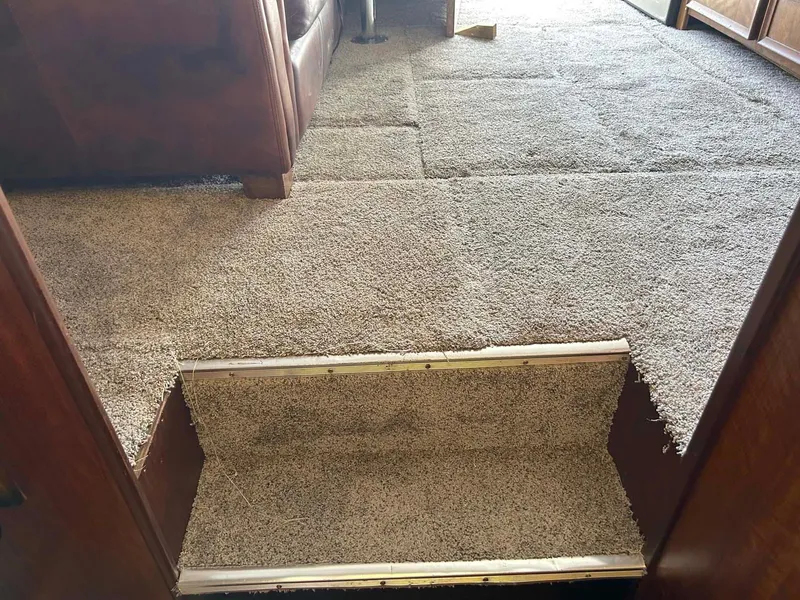 Slide: The Image of Carpeted interior of 1975 Hatteras 36 Convertible yacht with step detail. - 28