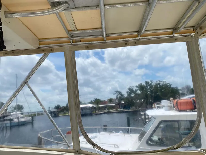 Slide: The Image of View from 1975 Hatteras 36 Convertible boat, overlooking marina and cloudy sky. - 40