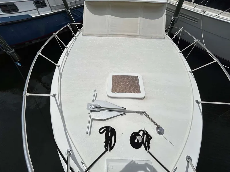 Slide: The Image of 1975 Hatteras 36 Convertible boat deck with anchor and ropes. - 49