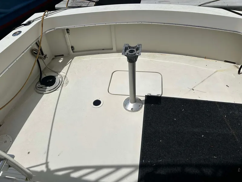 Slide: The Image of 1975 Hatteras 36 Convertible boat deck with pedestal and carpet. - 5