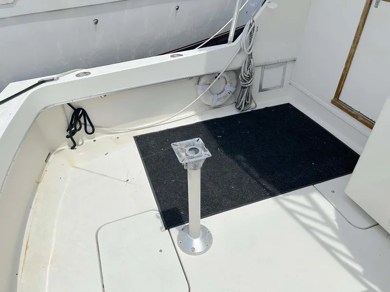 Slide: The Image of 1975 Hatteras 36 Convertible boat deck with pedestal and black mat. - 7