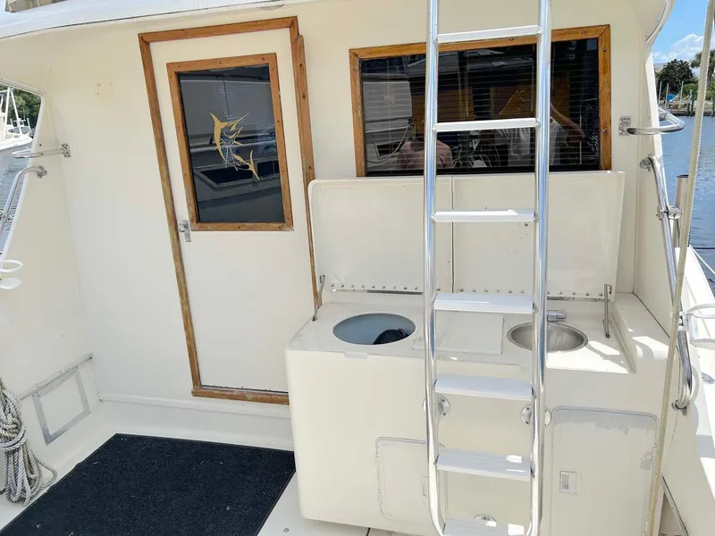 Slide: The Image of 1975 Hatteras 36 Convertible boat deck with ladder and door. - 9