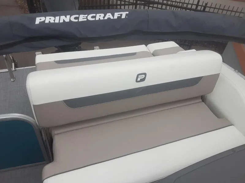 Slide: The Image of 2024 Princecraft Vectra 21 RL boat seating with logo, featuring beige and white upholstery. - 7