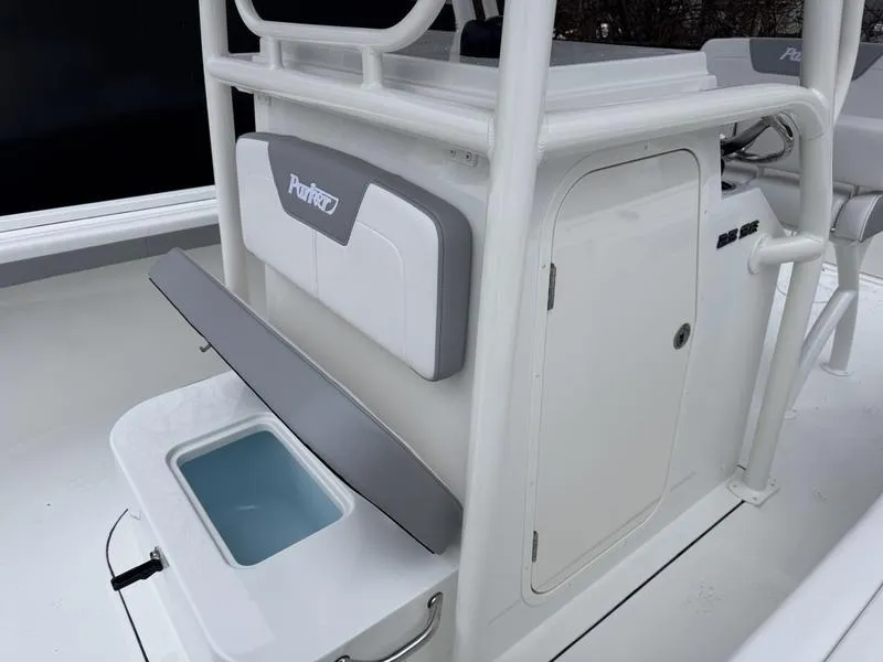 Slide: The Image of 2025 Parker 23 SE CC boat interior with storage compartment and seating. - 10
