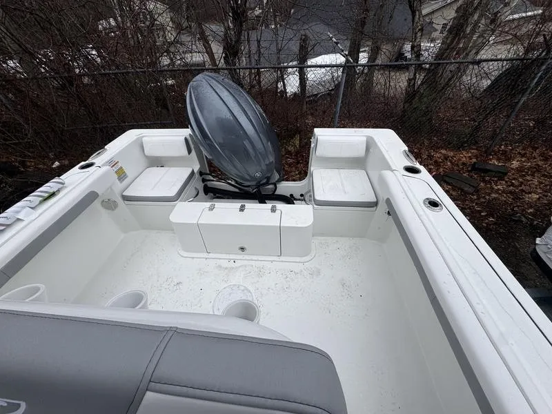 Slide: The Image of 2025 Parker 23 SE CC boat interior with seating and storage compartments. - 7