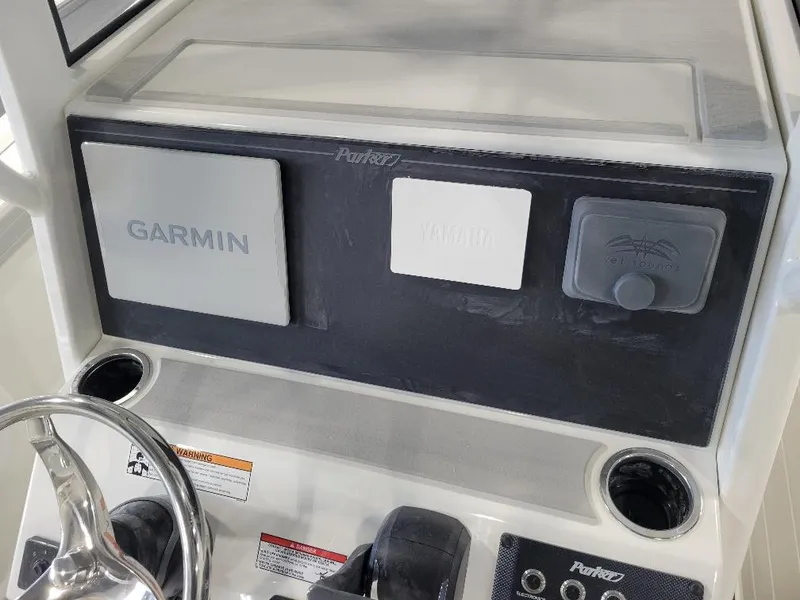 Slide: The Image of Control panel of 2025 Parker 2200 CC boat with Garmin electronics. - 13