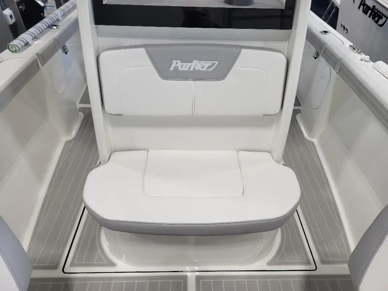 Slide: The Image of 2025 Parker 2200 CC boat interior with white seating and sleek design. - 18
