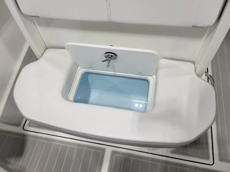 Slide: The Image of 2025 Parker 2200 CC boat interior with open storage compartment. - 19