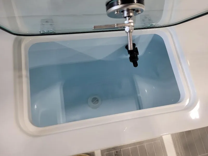 Slide: The Image of Livewell compartment in 2025 Parker 2200 CC boat, featuring a clean, modern design. - 21