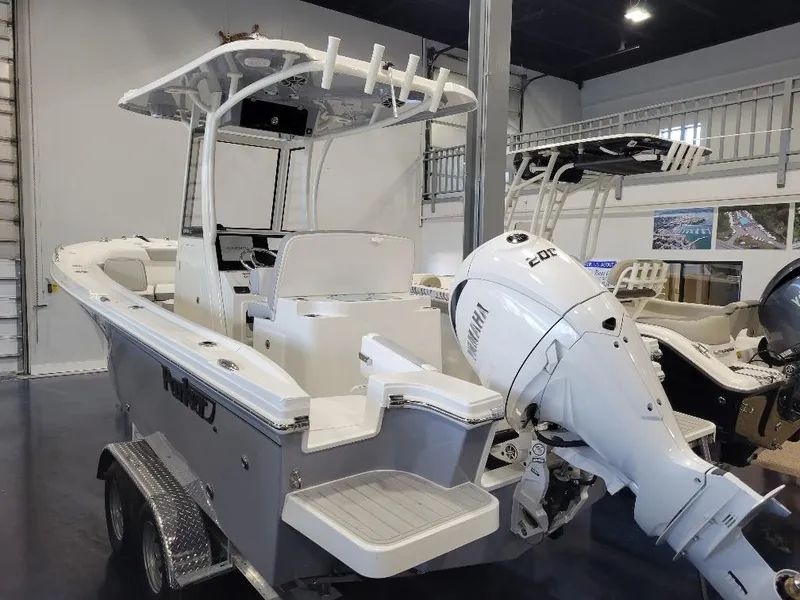 Slide: The Image of 2025 Parker 2200 CC boat with Yamaha engine in showroom. - 5