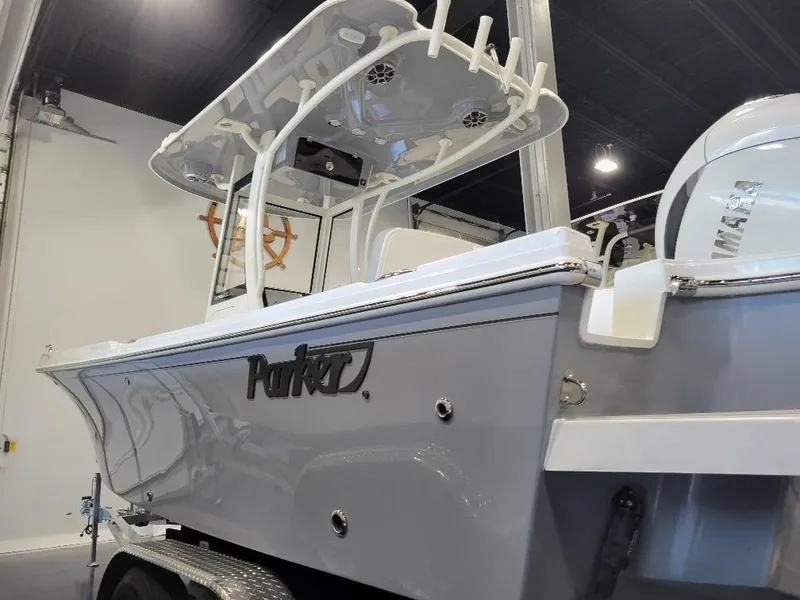 Slide: The Image of 2025 Parker 2200 CC boat in showroom, featuring sleek design and modern amenities. - 6