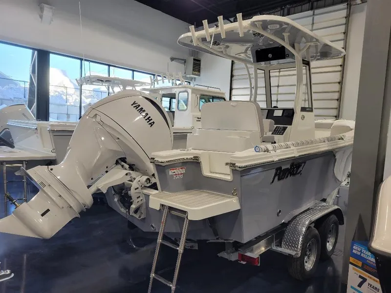 Slide: The Image of 2025 Parker 2200 CC boat with Yamaha engine displayed in showroom. - 7