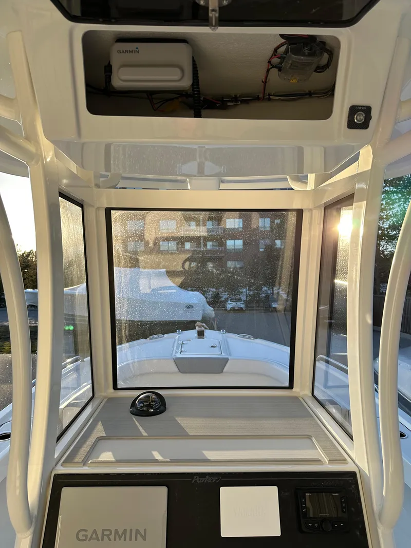 Slide: The Image of 2025 Parker 2200 CC boat cockpit with Garmin navigation system, showcasing modern design and technology. - 15