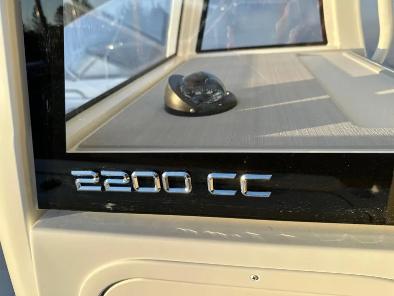 Slide: The Image of 2025 Parker 2200 CC boat dashboard with compass in sunlight. - 16