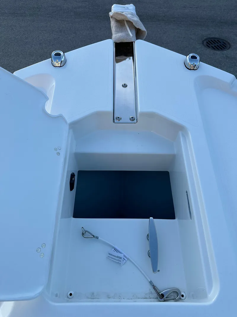 Slide: The Image of 2025 Parker 2200 CC boat anchor storage compartment with open hatch. - 19