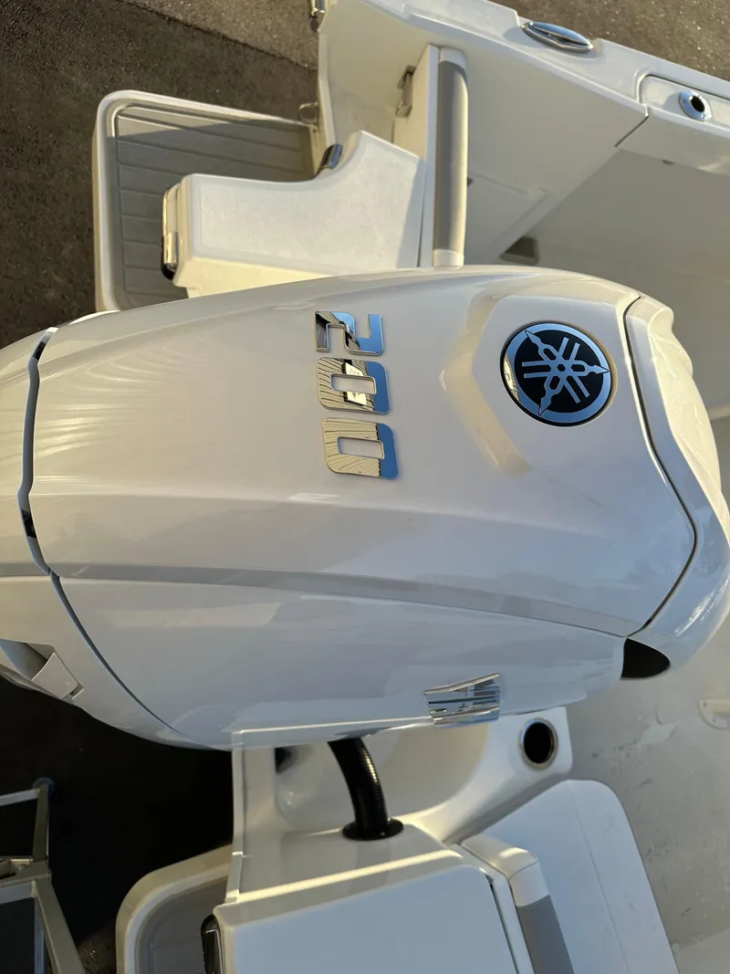 Slide: The Image of 2025 Parker 2200 CC boat with Yamaha 200 outboard motor. - 6