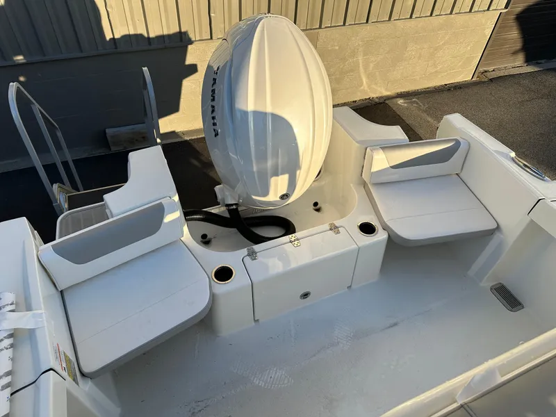 Slide: The Image of 2025 Parker 2200 CC boat with dual seating and outboard motor. - 8