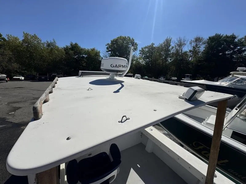 Slide: The Image of 1996 Eastern 27 Lobster Fisherman boat with Garmin radar, docked outdoors. - 9