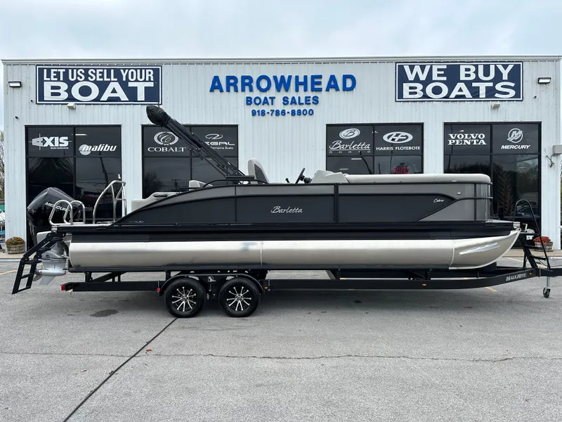 Slide: The Image of 2025 Barletta C24UC pontoon boat at Arrowhead Boat Sales dealership. - 1