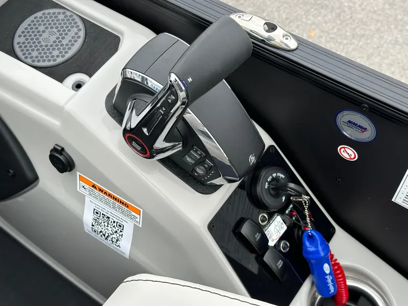 Slide: The Image of 2025 Barletta C24UC boat control panel with throttle and ignition switch. - 18