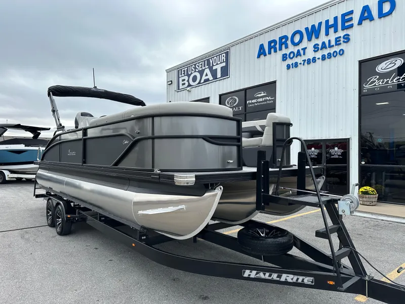 Slide: The Image of 2025 Barletta C24UC pontoon boat at Arrowhead Boat Sales dealership. - 2