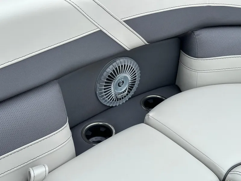 Slide: The Image of 2025 Barletta C24UC boat interior with cup holders and fan detail. - 24