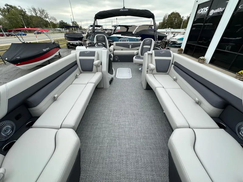 Slide: The Image of 2025 Barletta C24UC pontoon boat interior with spacious seating and modern design. - 25