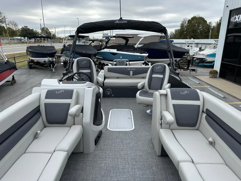 Slide: The Image of 2025 Barletta C24UC pontoon boat with luxurious seating and modern design. - 26