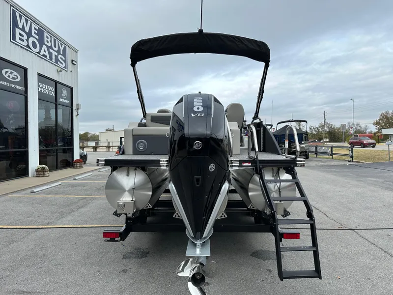 Slide: The Image of 2025 Barletta C24UC pontoon boat with powerful Mercury 150 V8 engine at dealership. - 8