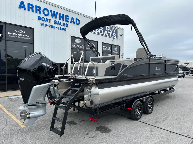 Slide: The Image of 2025 Barletta C24UC pontoon boat at Arrowhead Boat Sales dealership. - 9