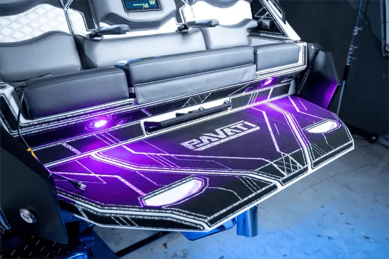 Slide: The Image of 2021 Pavati AL26 boat interior with illuminated deck and modern seating. - 2