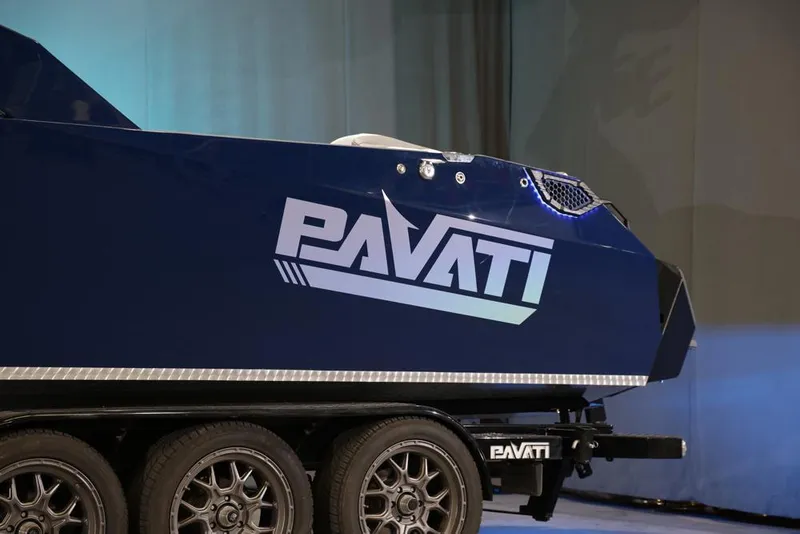 Slide: The Image of 2021 Pavati AL26 boat on trailer, showcasing sleek design and logo. - 3
