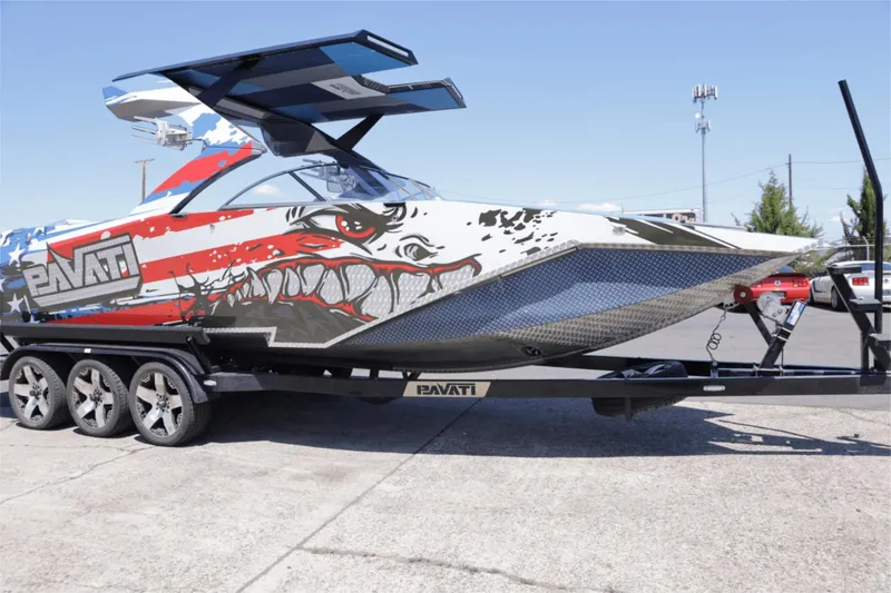 Slide: The Image of 2017 Pavati AL26 boat with custom American flag and eagle design on trailer. - 1