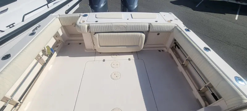 Slide: The Image of 2008 Grady-White 330 Express boat deck with seating and storage compartments. - 15
