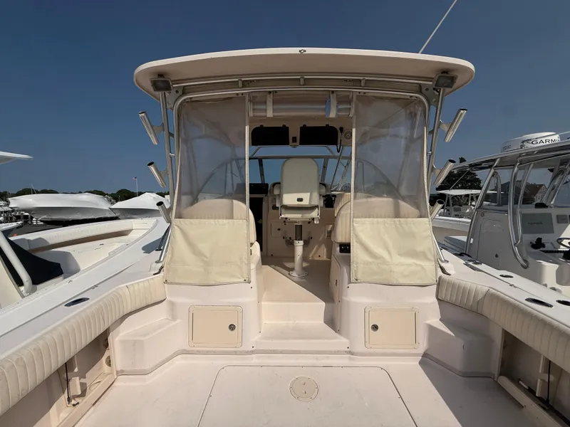 Slide: The Image of 2008 Grady-White 330 Express boat cockpit with seating and helm station. - 19