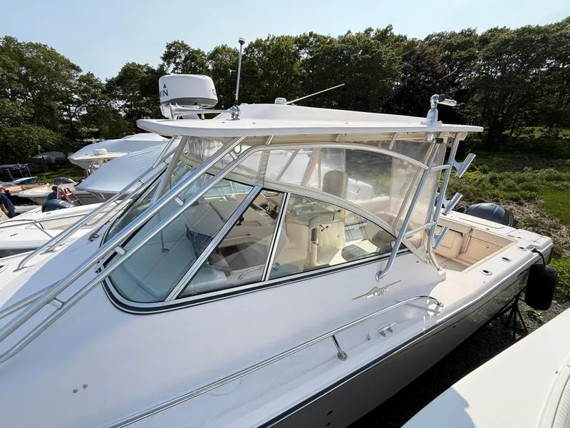 Slide: The Image of 2008 Grady-White 330 Express boat with enclosed cockpit, docked outdoors. - 20