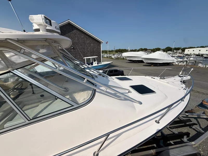 Slide: The Image of 2008 Grady-White 330 Express boat on display at a marina. - 23