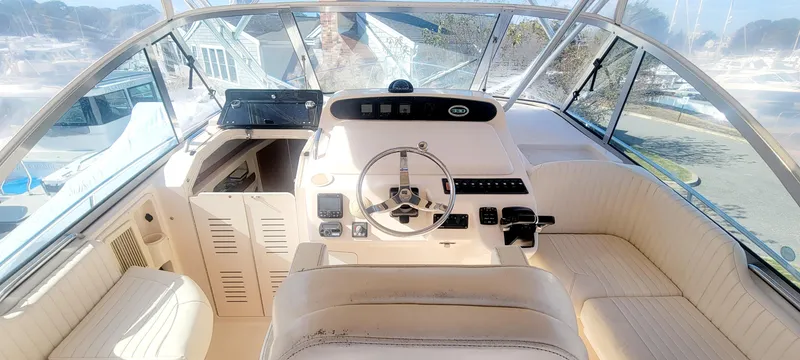 Slide: The Image of 2008 Grady-White 330 Express boat cockpit with steering wheel and seating. - 3