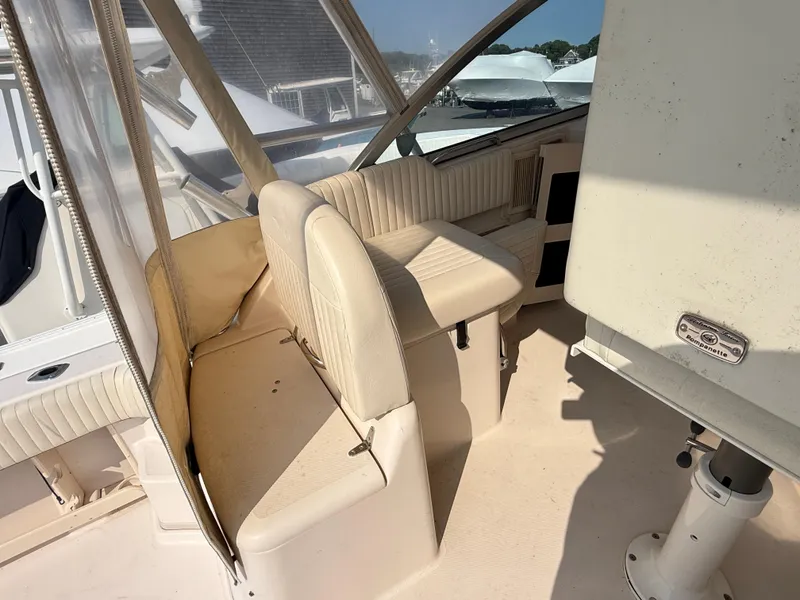 Slide: The Image of 2008 Grady-White 330 Express boat interior with beige seating and helm area. - 31
